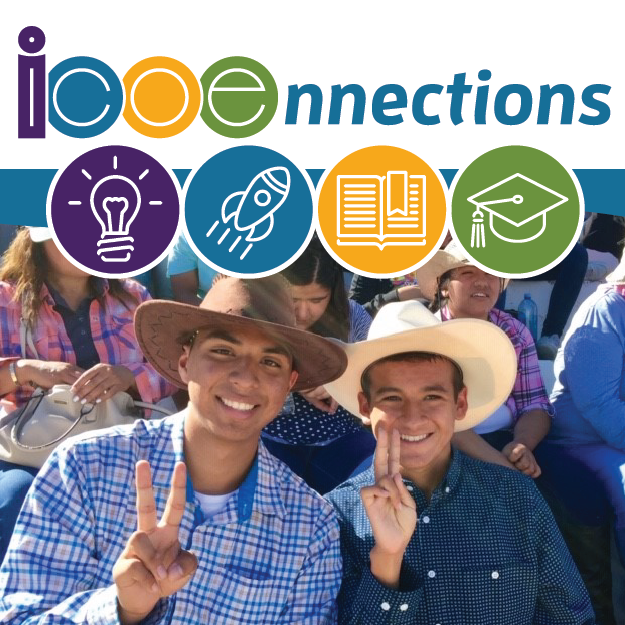 students wearing cowboy hats at a rodeo