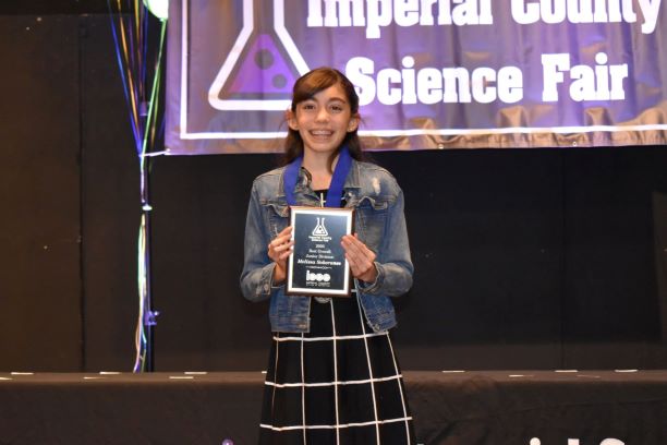 Girl Holding Award