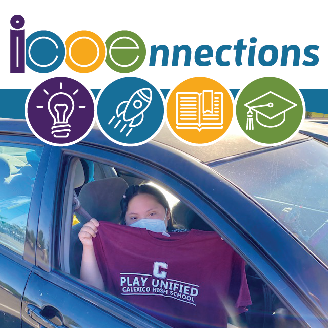 student in car holding t-shirt