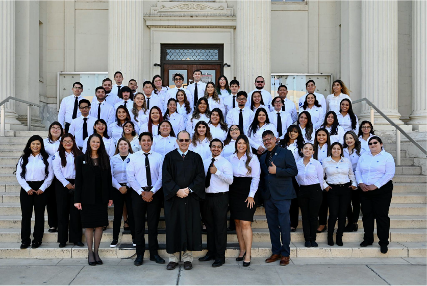 56 AmeriCorps Members in front of courthouse.