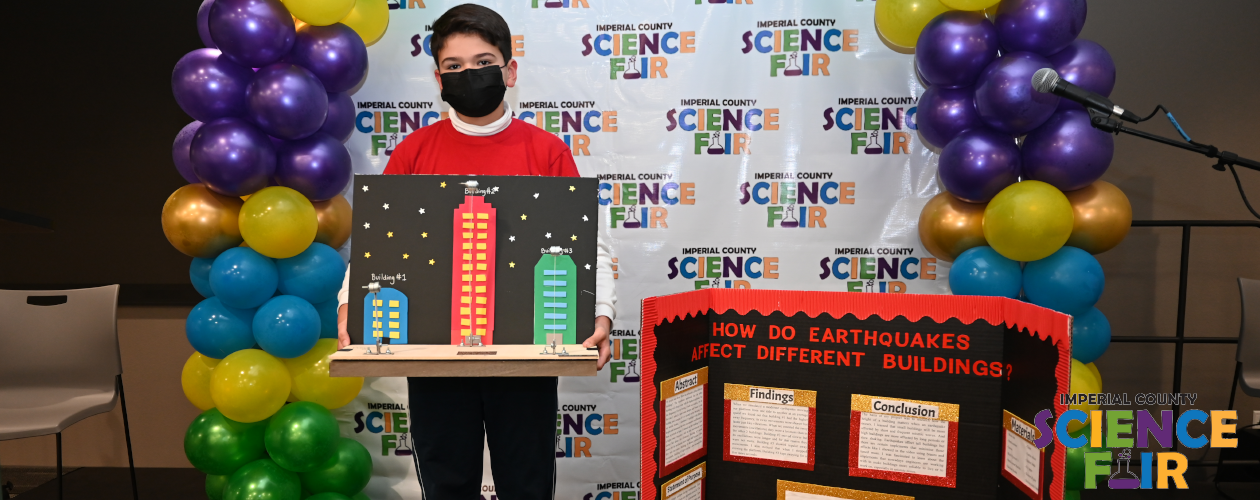 Science Fair - Student presenting about How do earthquakes affect different buildings